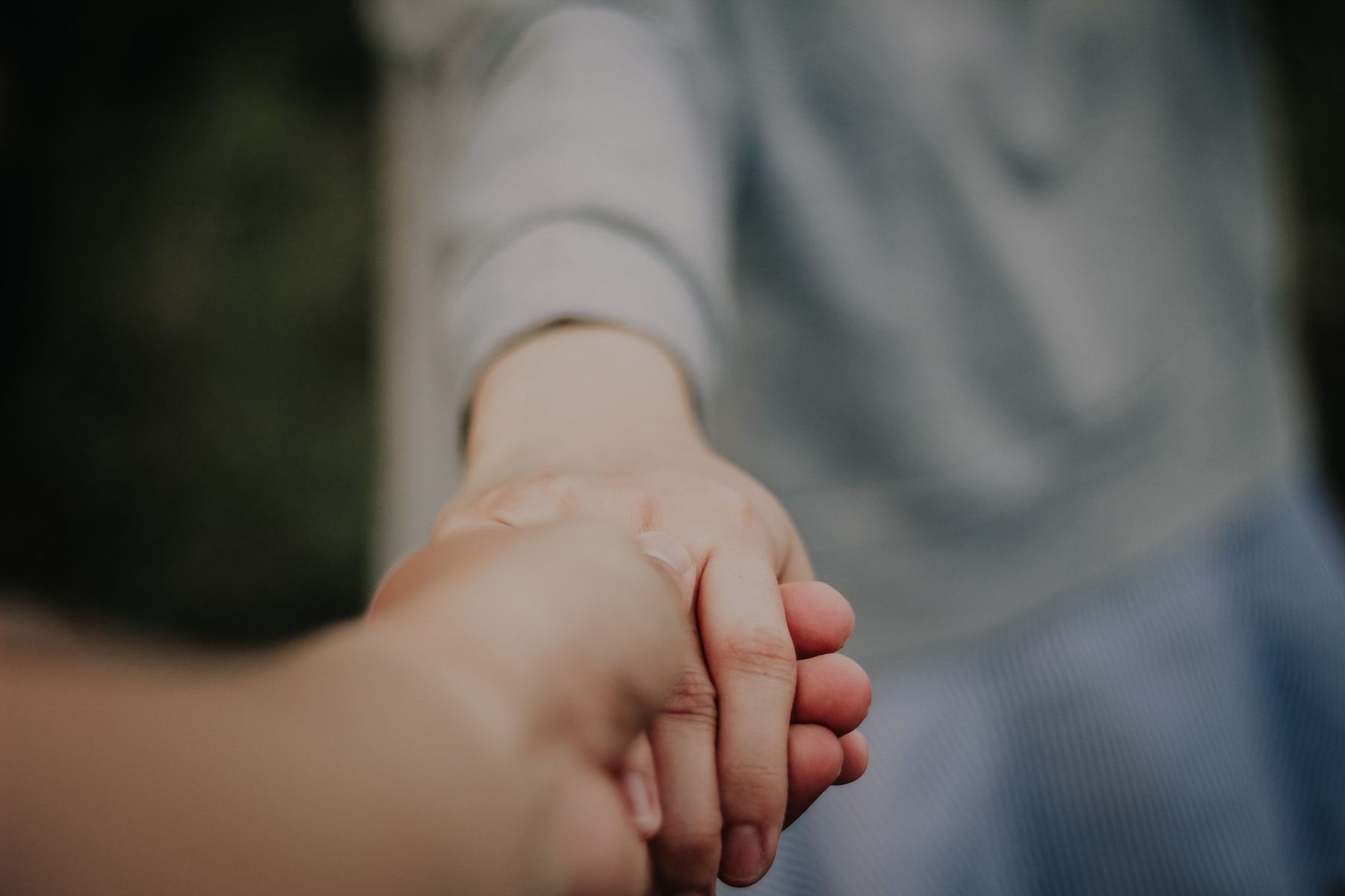 Hands held in support